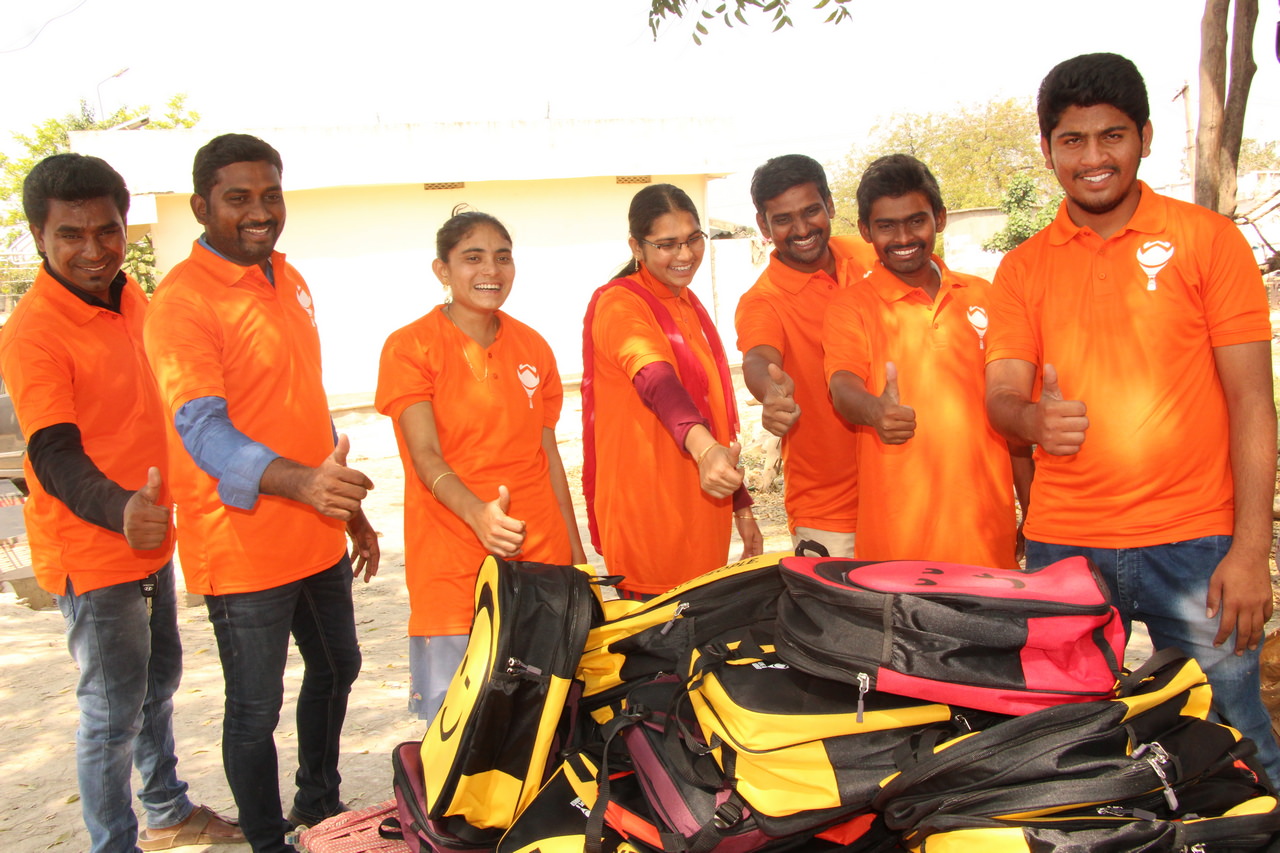 Hope Carrier volunteers preparing to hand out backpacks