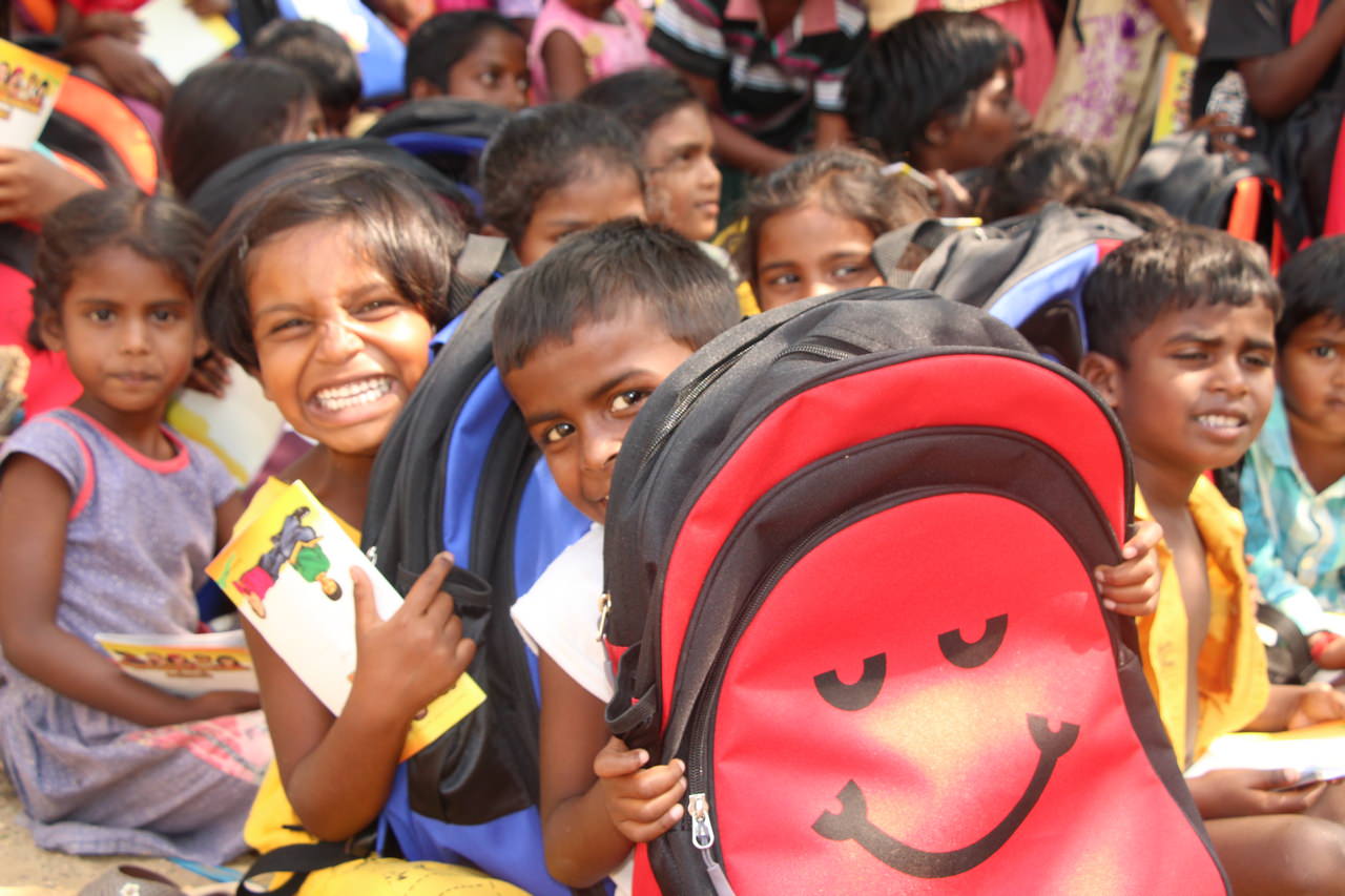 A joyful response to receiving their school bags